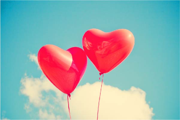 Two heart balloons together